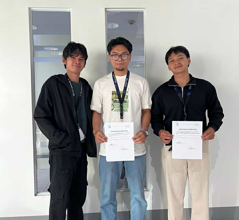 Geovanny and Marcus with Sir Christian at Blueshift Energy, holding certificates of completion